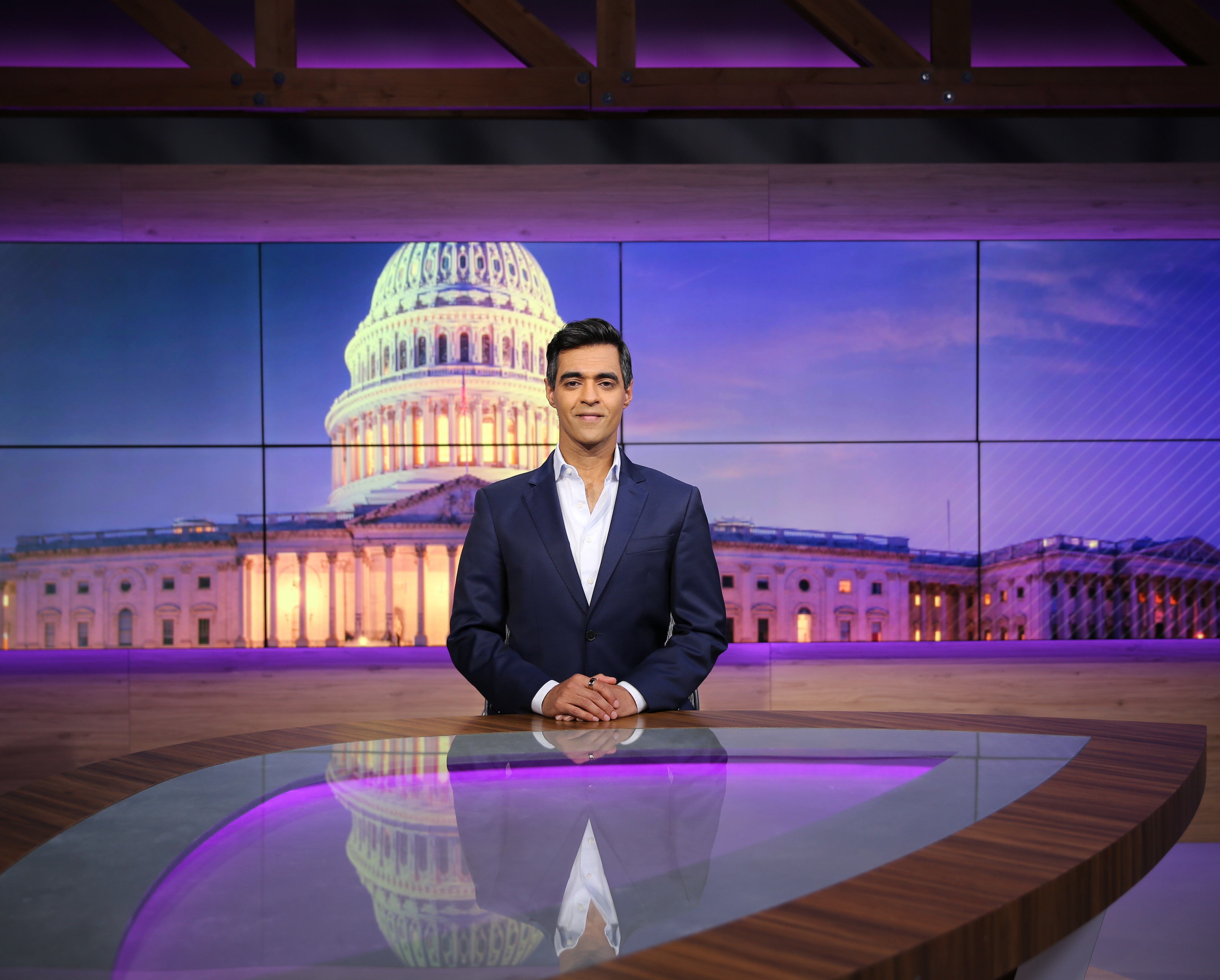 Amrit Singh at the Spectrum News 1 anchor desk